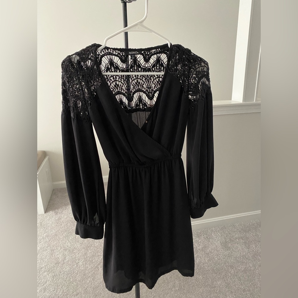 Black flowy mini dress with v-neck and lace back detail